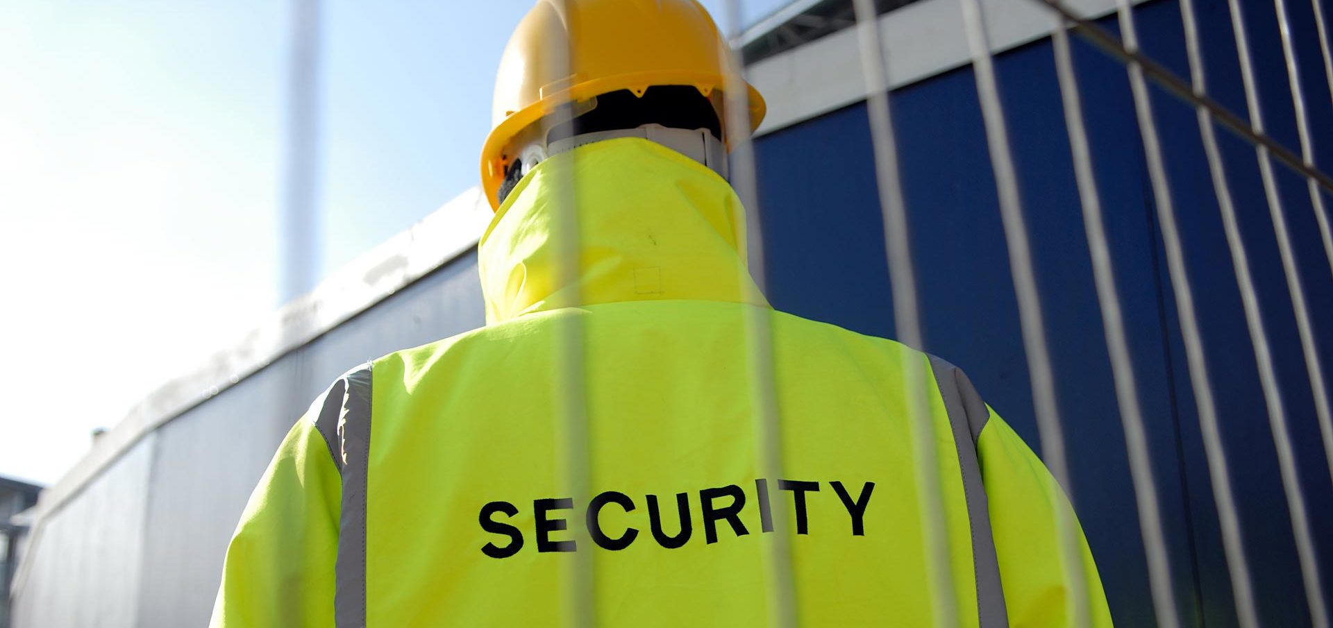 A security worker wearing a helmet