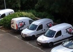 Company vans parked in a car park